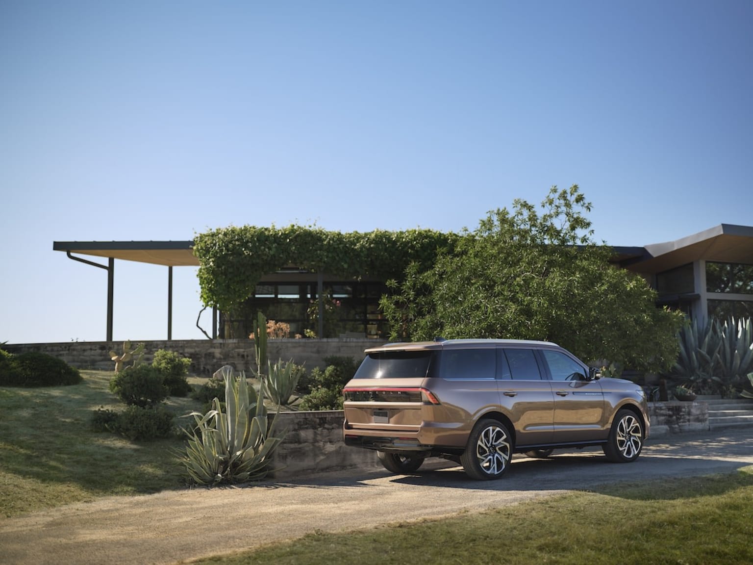 Lincoln Navigator Black Label parked in the driveway of a home
