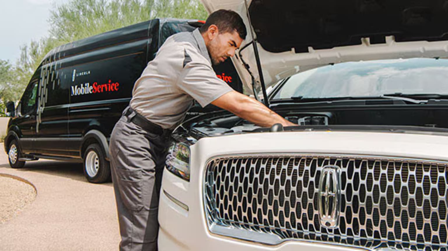 J.C. Lewis mobile service technician working on a vehicle
