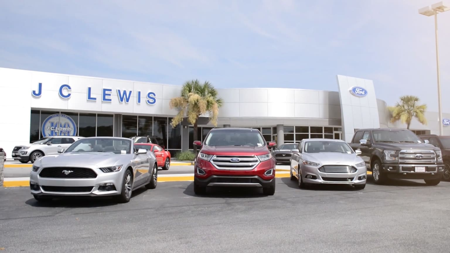 J.C. Lewis Ford Savannah dealership exterior with vehicles and palm trees