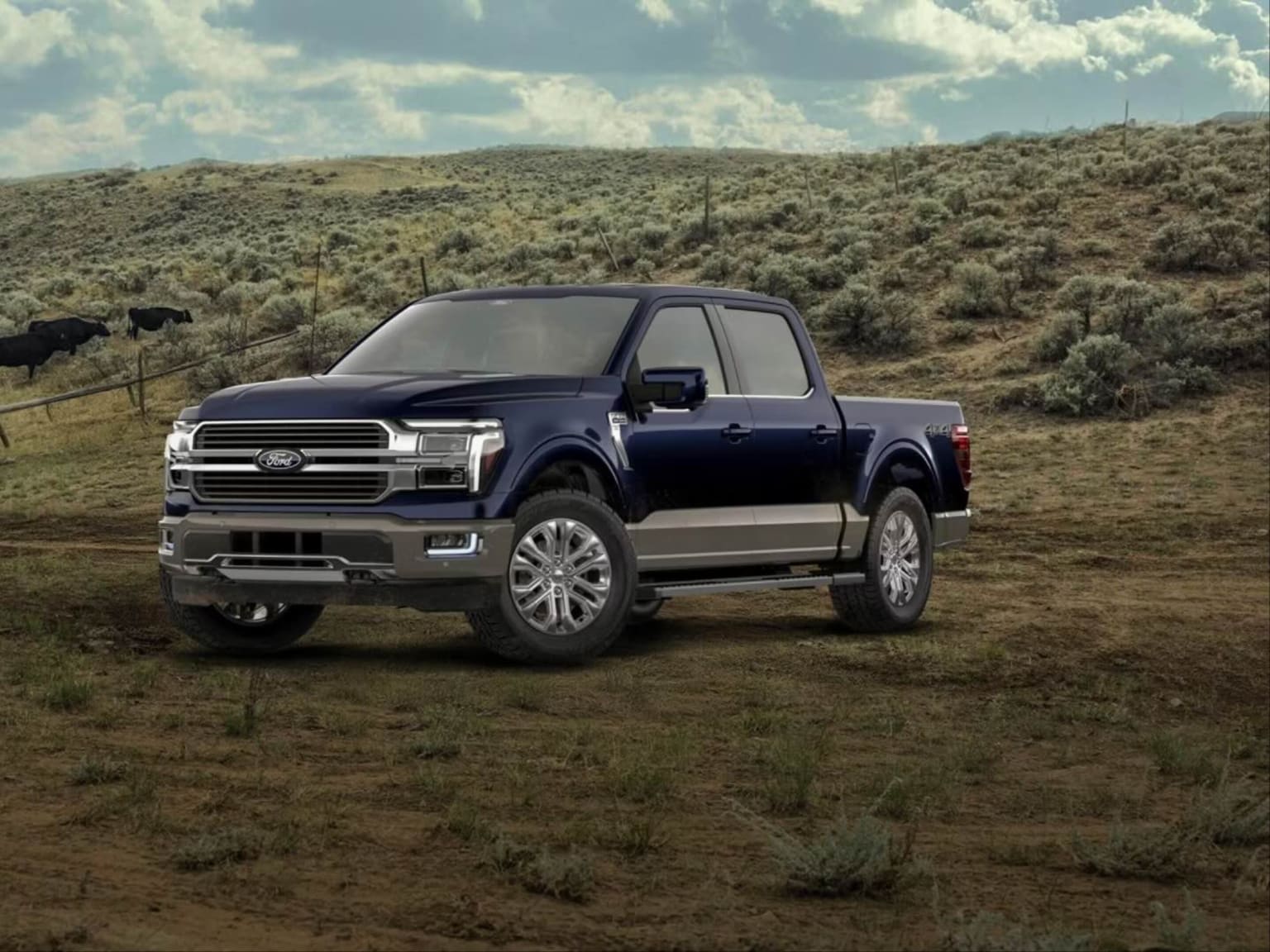 A dark blue pickup truck sits on a dirt path against a backdrop of rolling, brush-covered hills and a cloudy sky.