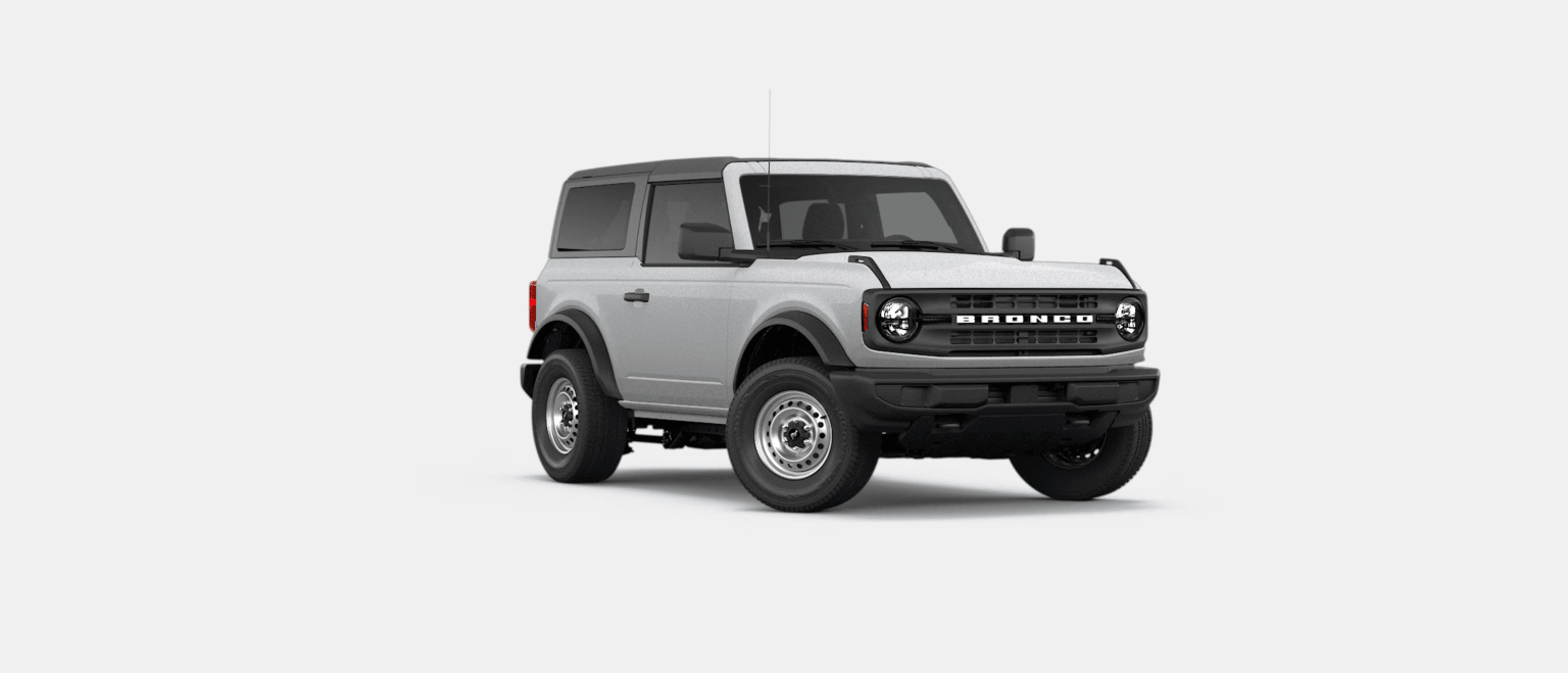A light gray two-door SUV with a black roof is positioned on a plain white background.