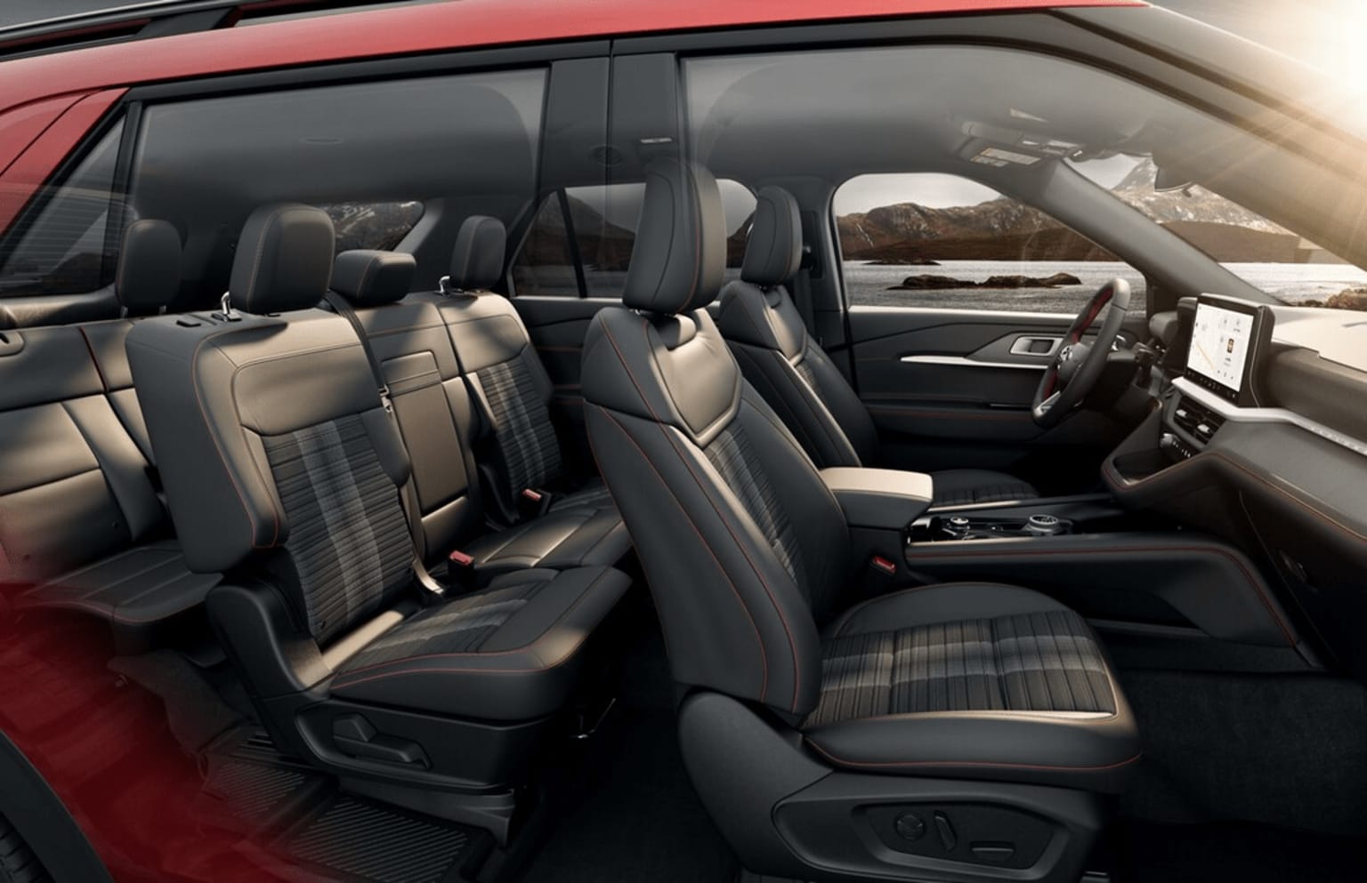 Interior of a spacious vehicle with leather seats and a high-tech dashboard.