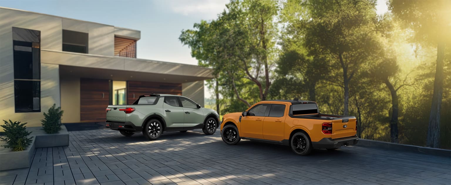 Two modern, stylish vehicles parked in front of a contemporary residential building surrounded by lush greenery.