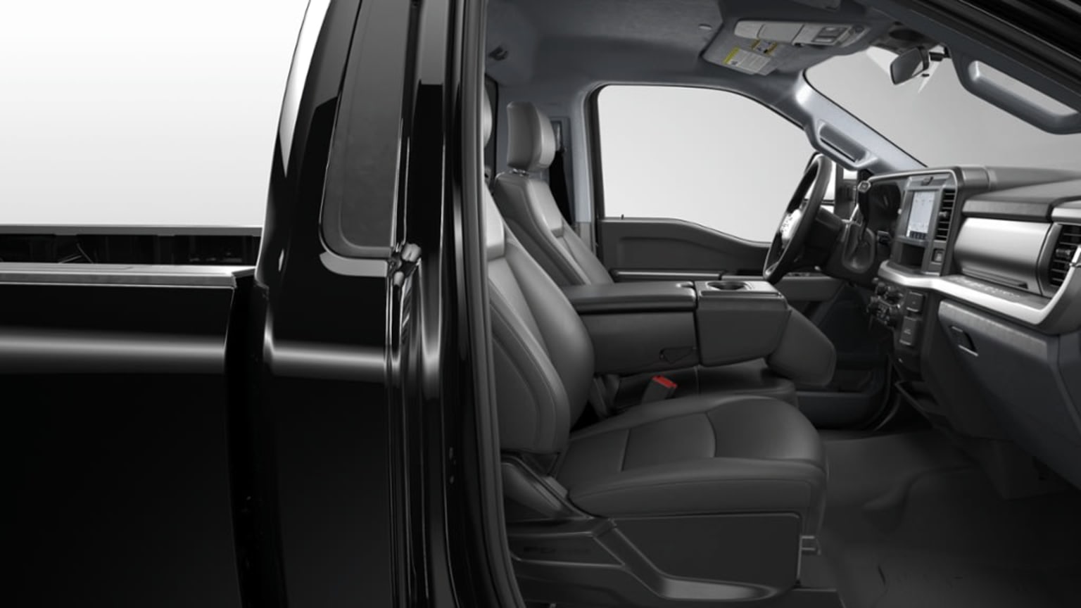 The image shows the interior of a vehicle, with the front seats and dashboard visible. The seats appear to be made of a dark material, and the dashboard has various controls and displays.