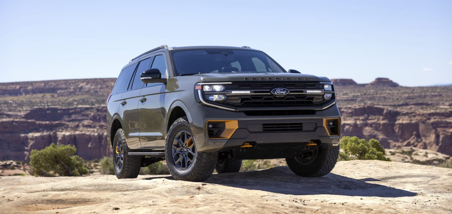 Off-road 2025 Ford Expedition on rocky terrain with dramatic landscape.