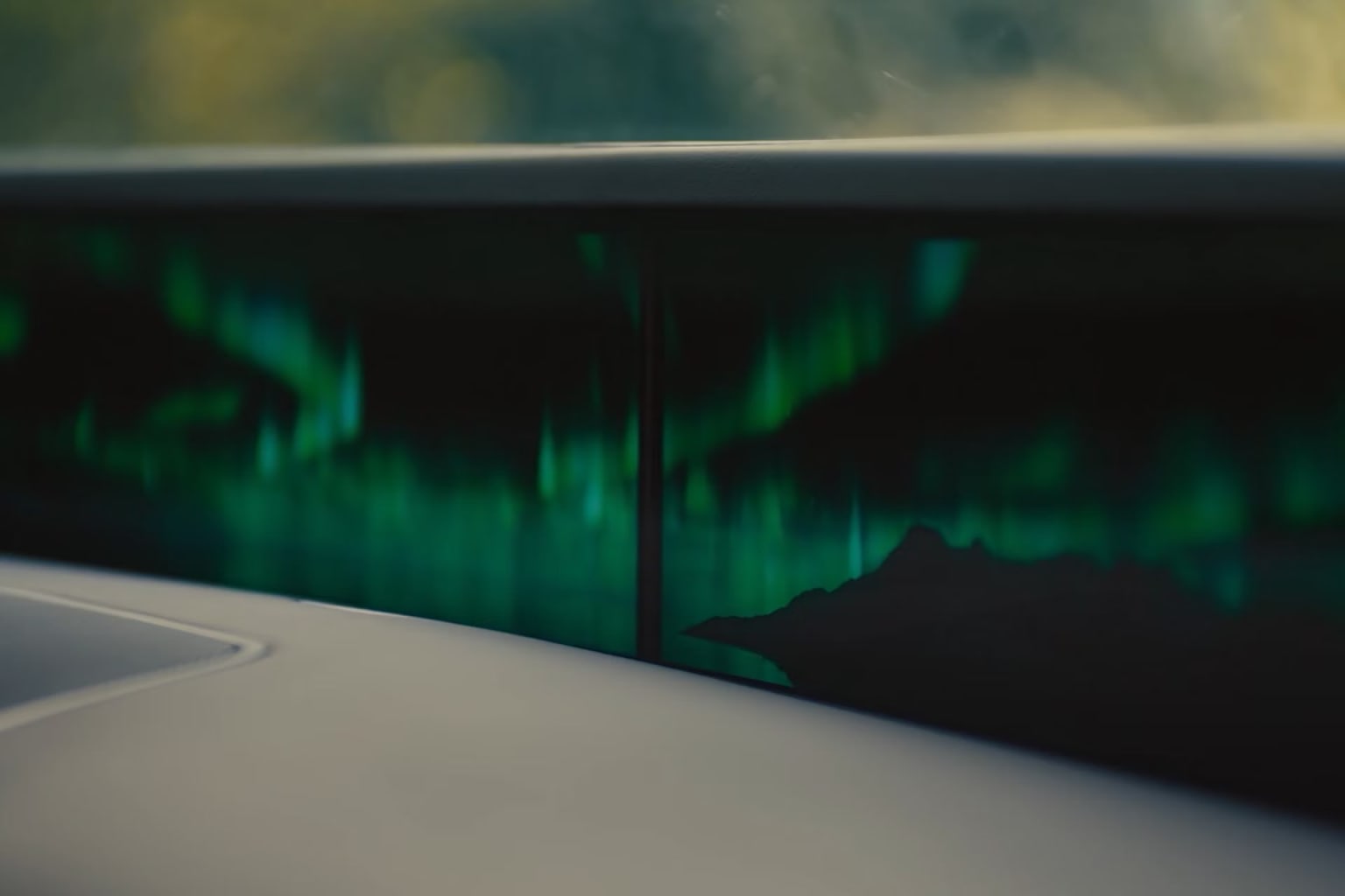 Abstract landscape showcasing lush green and blue hues, creating a dreamy, ethereal atmosphere.