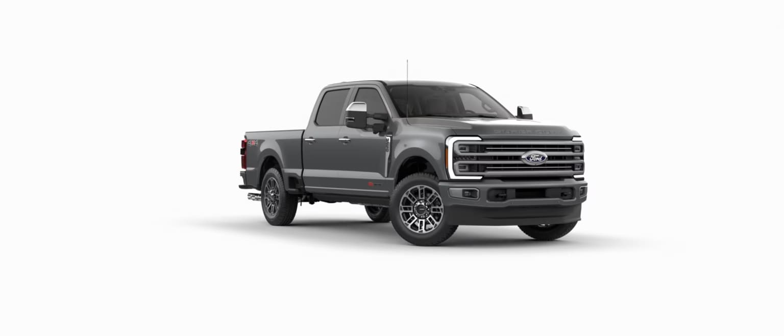 A grey pickup truck is parked in the center against a plain white background.
