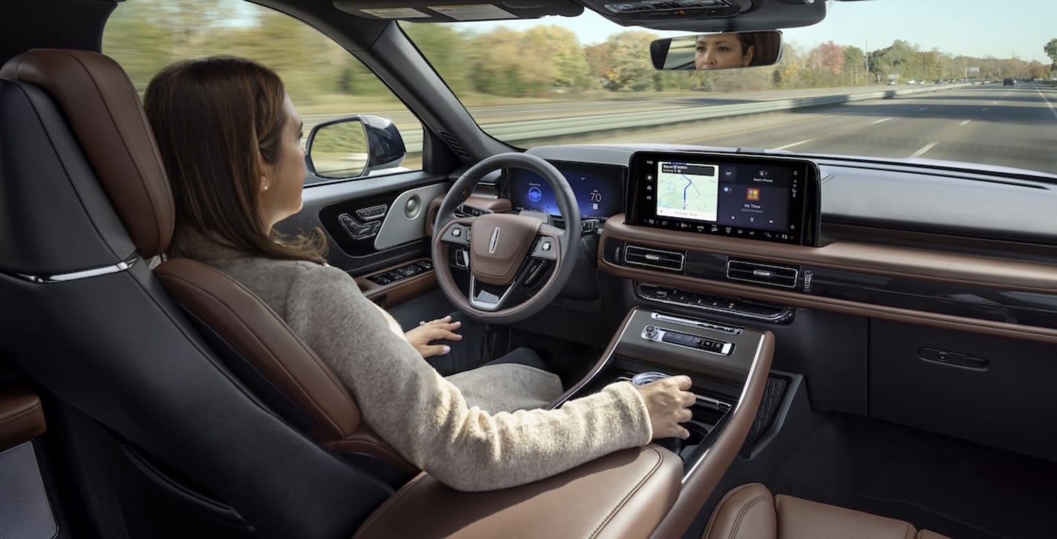 Lincoln Aviator Reserve with women using Lincoln BlueCruise hands-free driving
