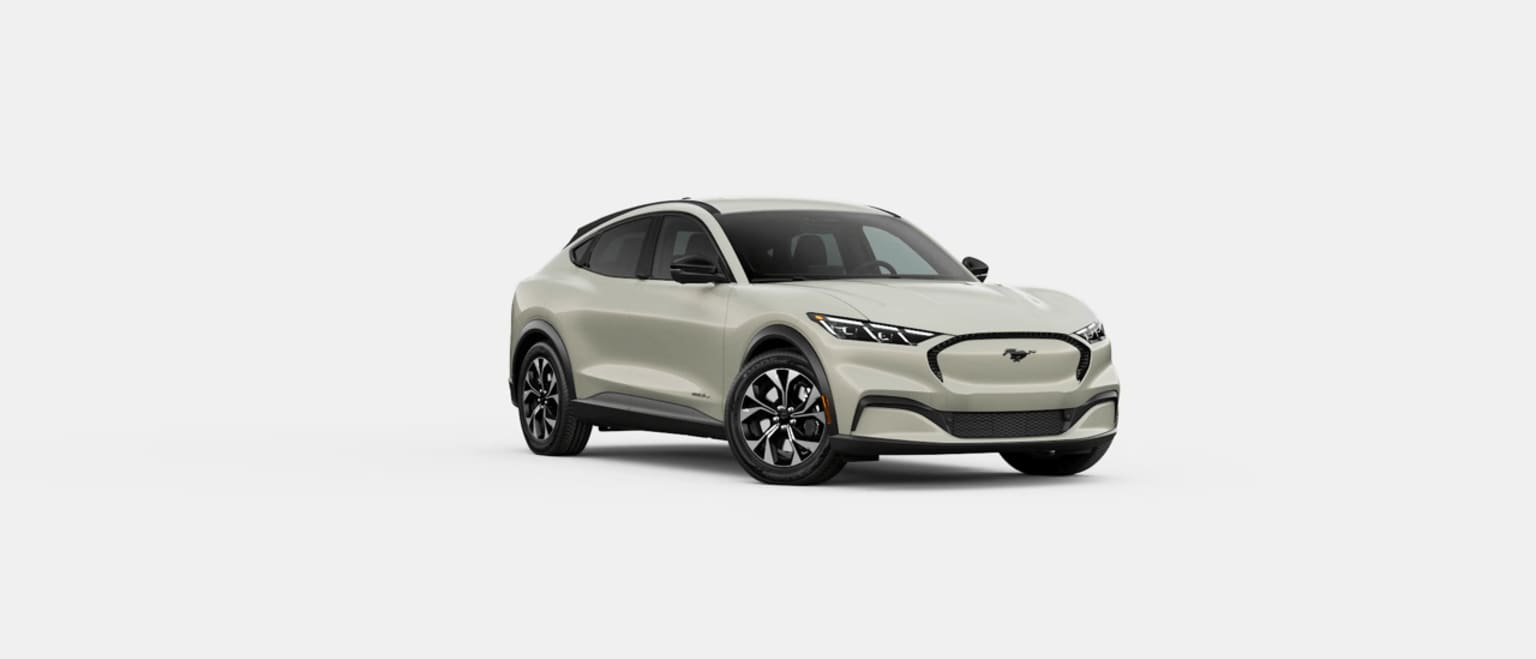 A sleek, white electric SUV with a modern, angular design stands prominently against a plain background.