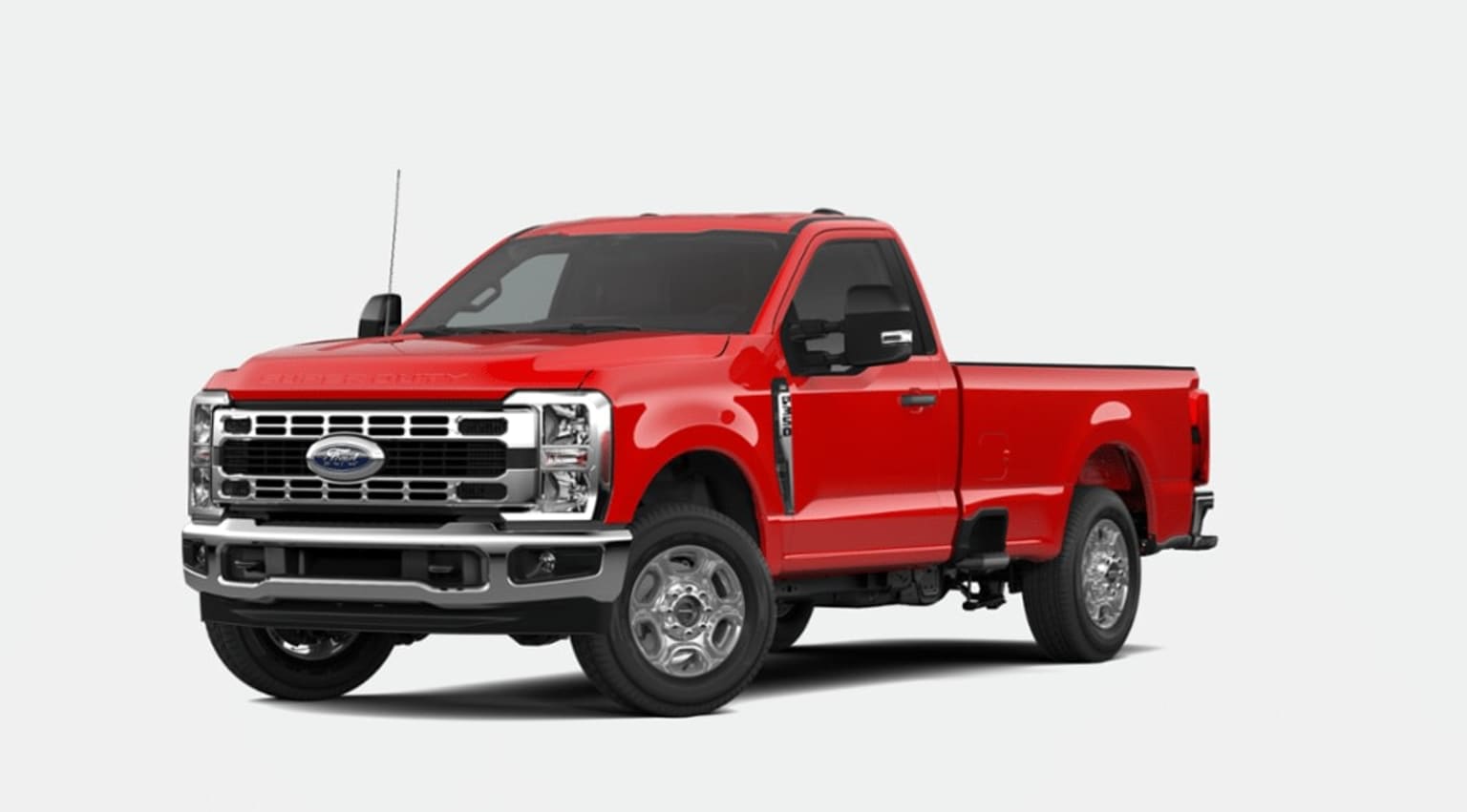 A bright red pickup truck with a rugged, off-road appearance stands prominently in the frame, set against a plain white background.