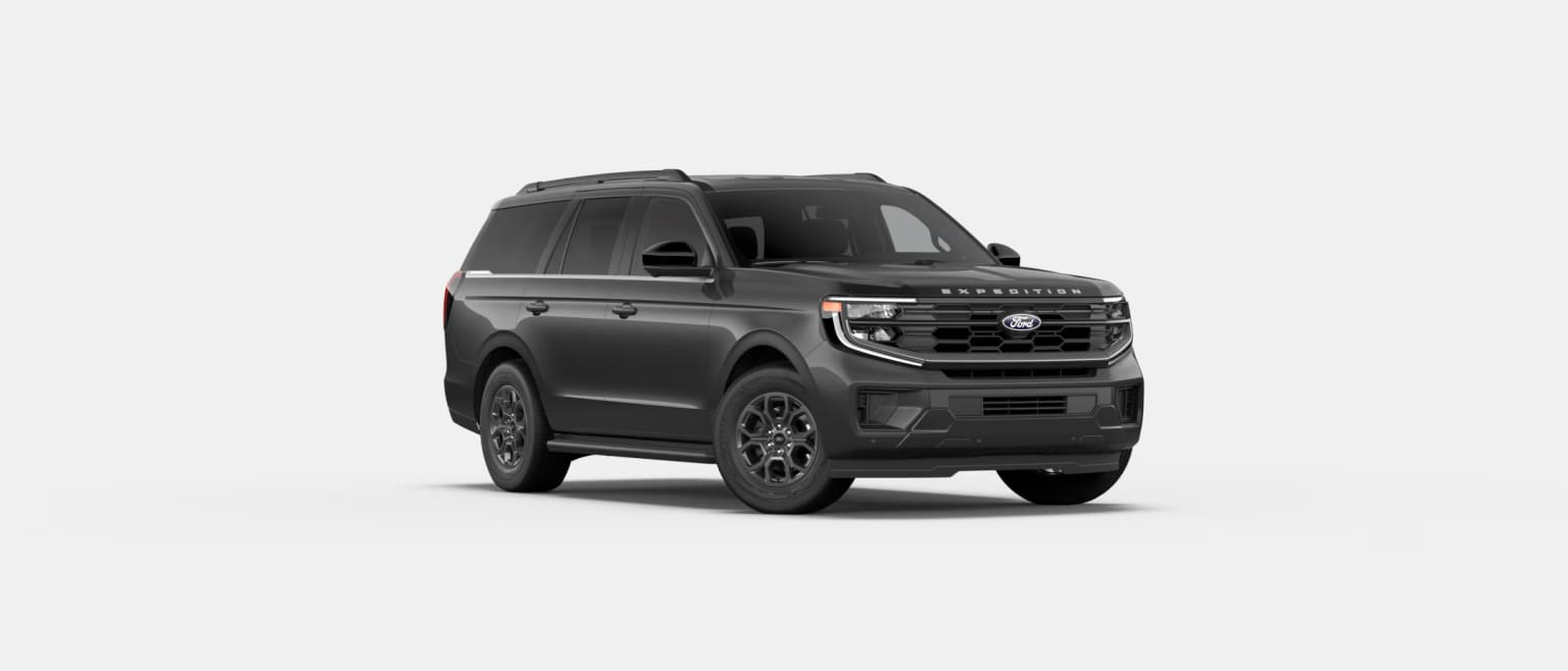 An off-road vehicle with a boxy, angular design and a prominent grille in black color, placed against a plain white background.