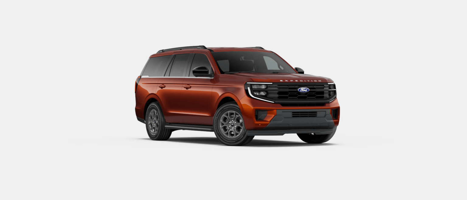 An orange SUV is centered in the foreground against a plain white background.