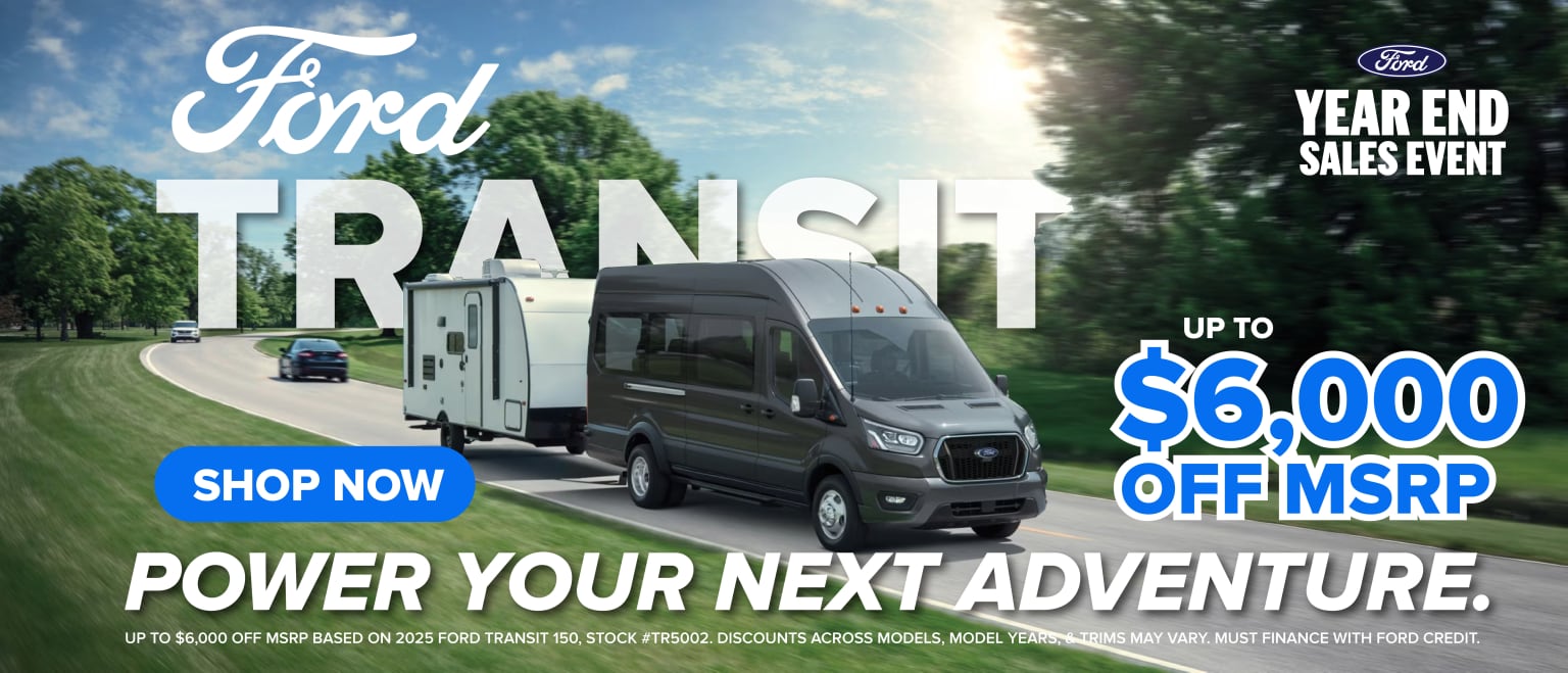 The image features a van prominently displayed in the foreground, with a logo and the text "TRANSIT" prominently displayed. The background shows a scenic outdoor setting with trees and a cloudy sky, along with a promotional message.