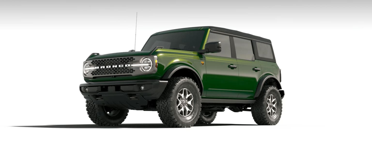 Off-road-ready green SUV with large tires and a boxy, utilitarian design.