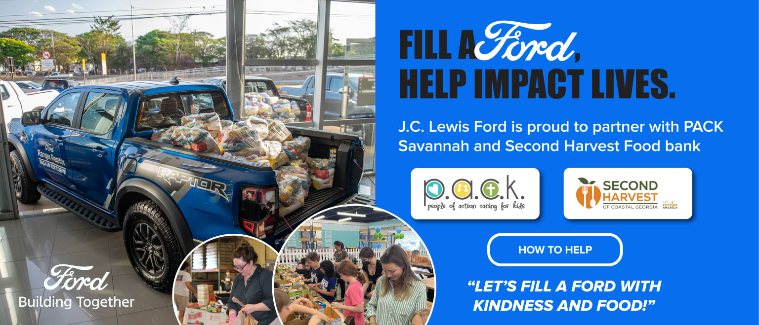Image of a truck filled with food donations partnering with local food banks to provide aid and impact lives, with a storefront in the background and a blue sky.