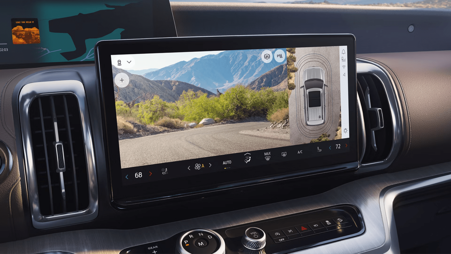 Dashboard displaying a scenic mountain road on touchscreen with bird's-eye view of the vehicle.