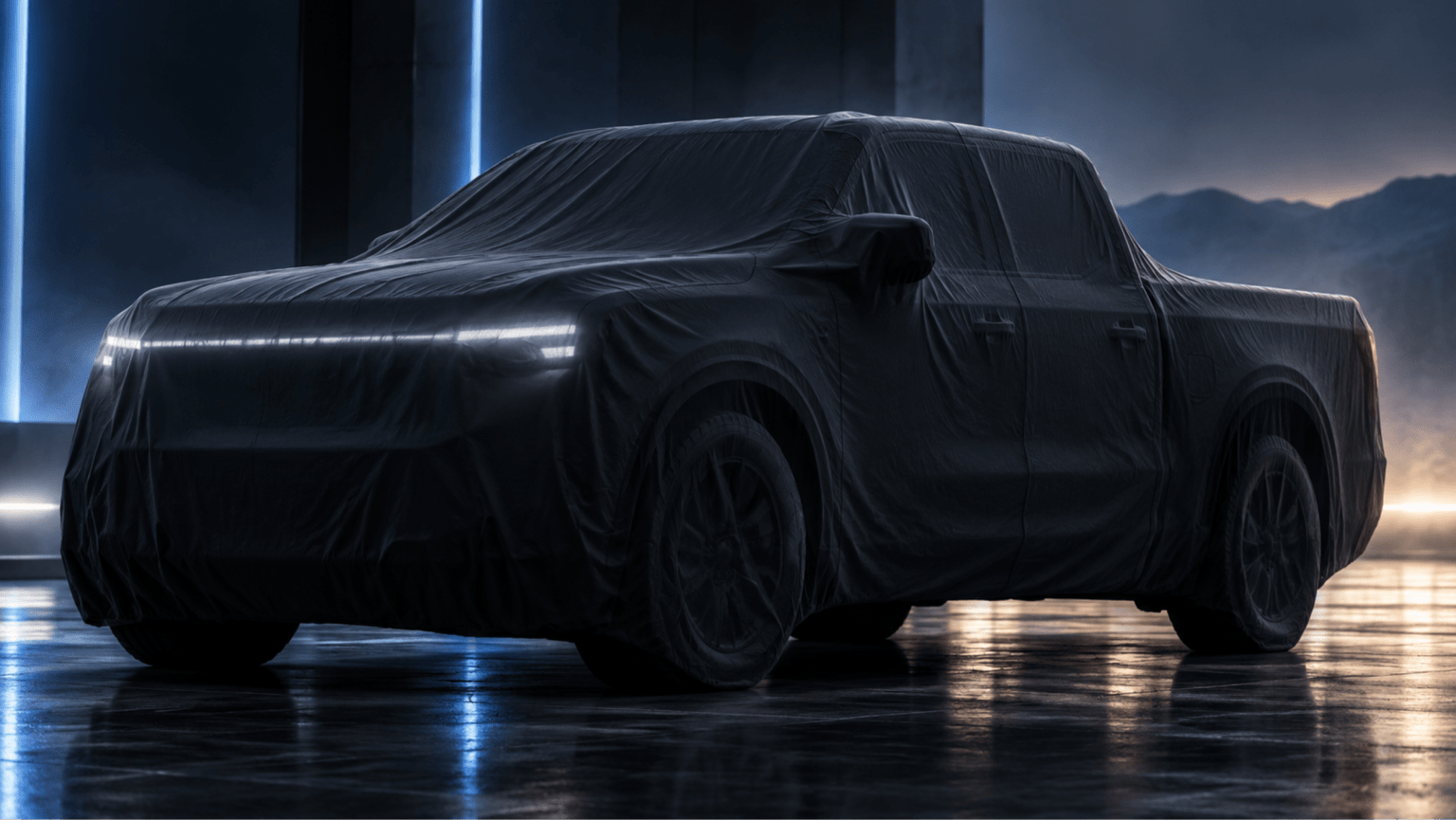 A covered pickup truck with glowing headlights sits on a reflective floor against a dark industrial backdrop with distant mountains.