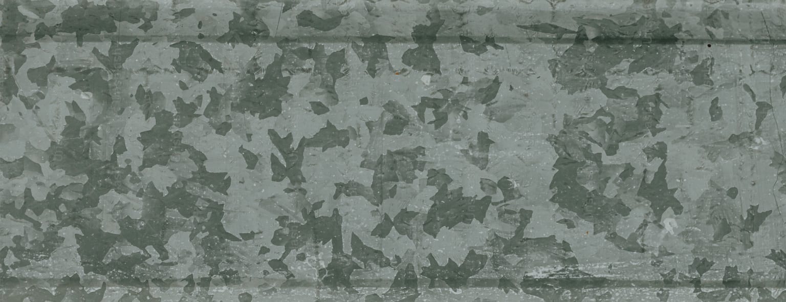 a grungy wall with a black and white design on the bottom half of the wall and the bottom half of the wall is black and white