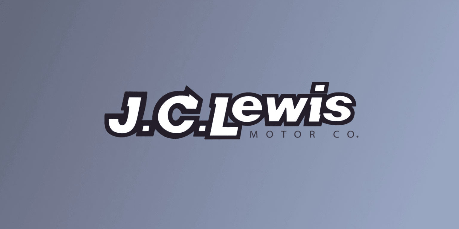 the j c lewis motor co logo on a gray background with a blue sky in the backround
