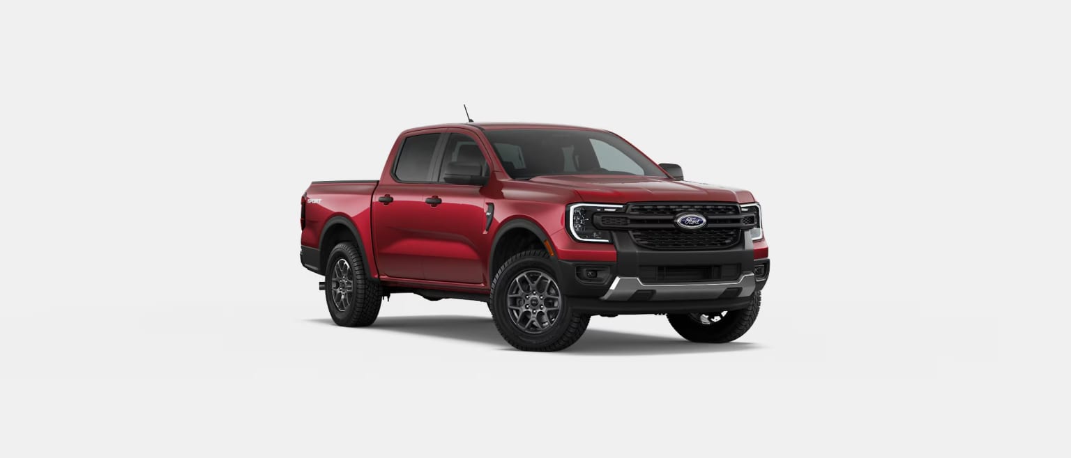 A red pickup truck with a bold, angular design stands prominently in the frame, its powerful presence commanding attention.