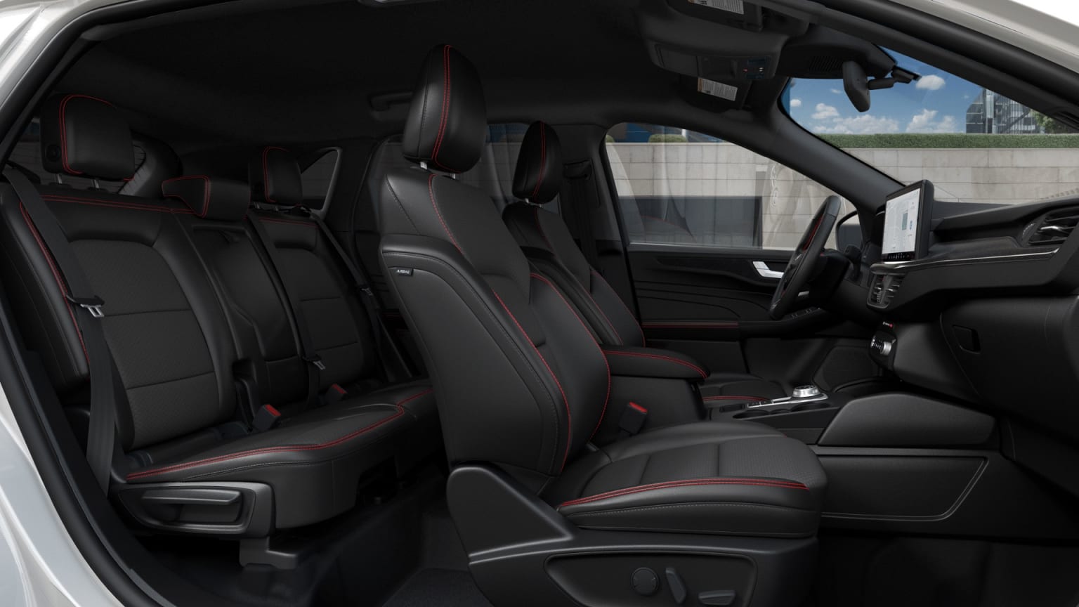 Interior of a vehicle with rows of black leather seats and dashboard visible.