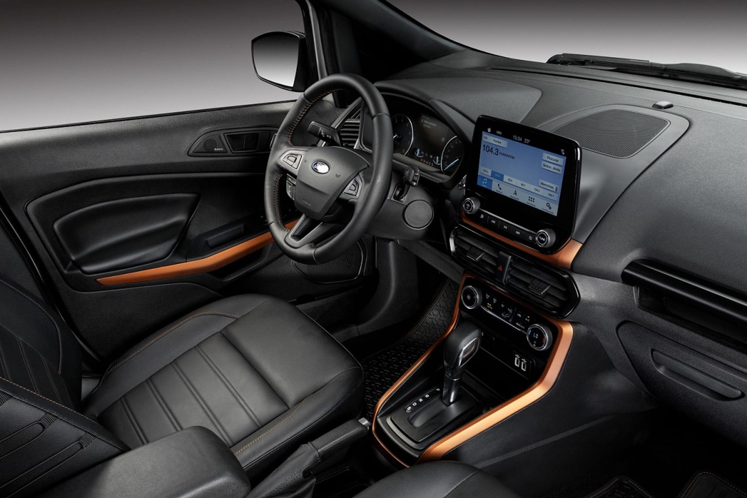 the interior of a car with a steering wheel, dashboard, and touch screen display on the dash of the vehicle