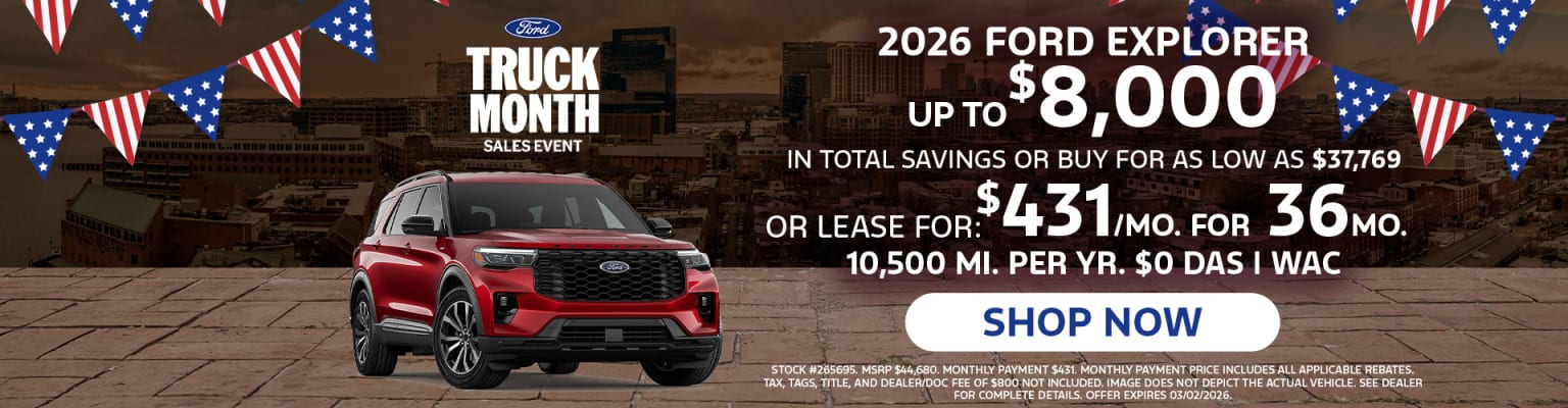 The image features a red SUV prominently displayed in the foreground, with a promotional advertisement for the 2026 model in the background, highlighting various savings and leasing options.