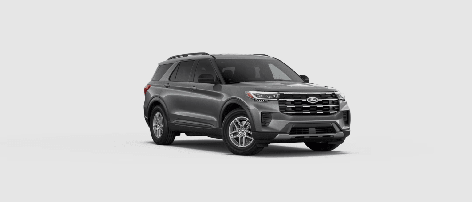 Grey SUV in foreground with plain background