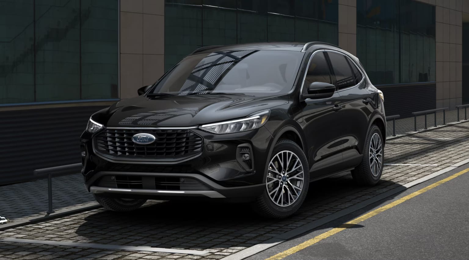 A sleek black SUV parked in front of a modern glass-fronted building.