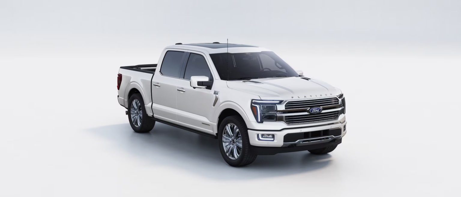 A white pickup truck with a sleek, modern design against a plain, light-colored background.
