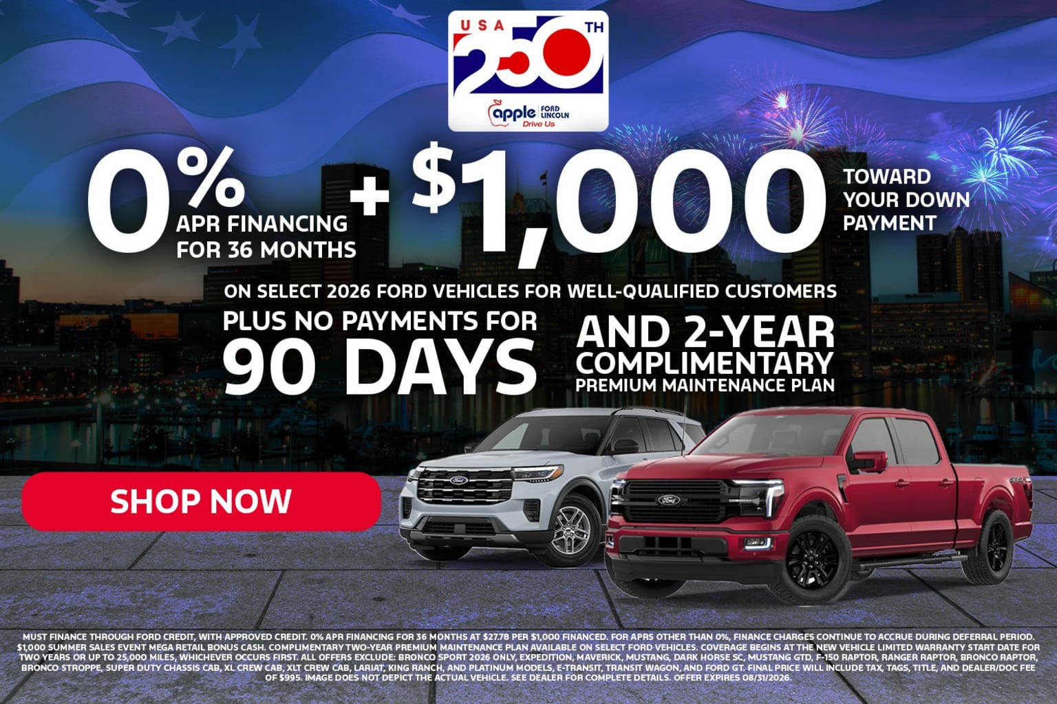 Two vehicles, a white SUV and a red pickup truck, are displayed in the foreground with a city skyline and fireworks in the background.