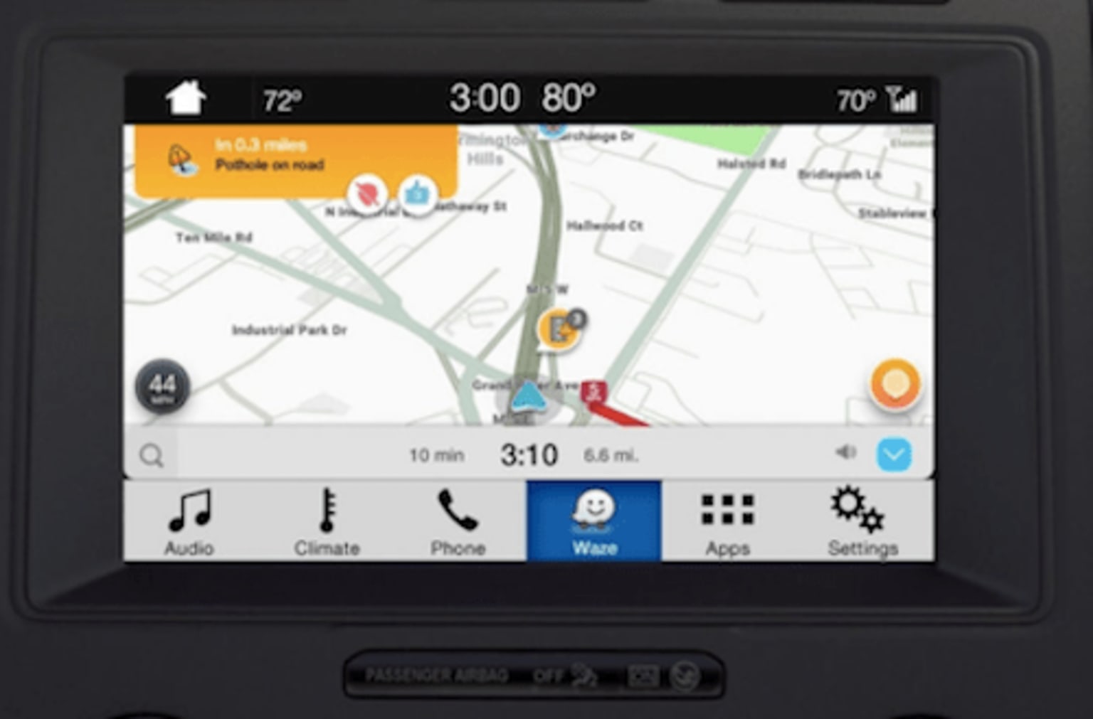 a gps device is shown with a map on the front of the device and a car's dashboard
