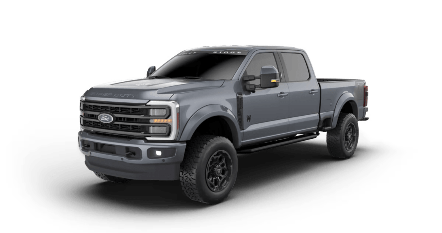 A large, rugged-looking gray pickup truck with off-road features and accessories, standing on a plain white background.
