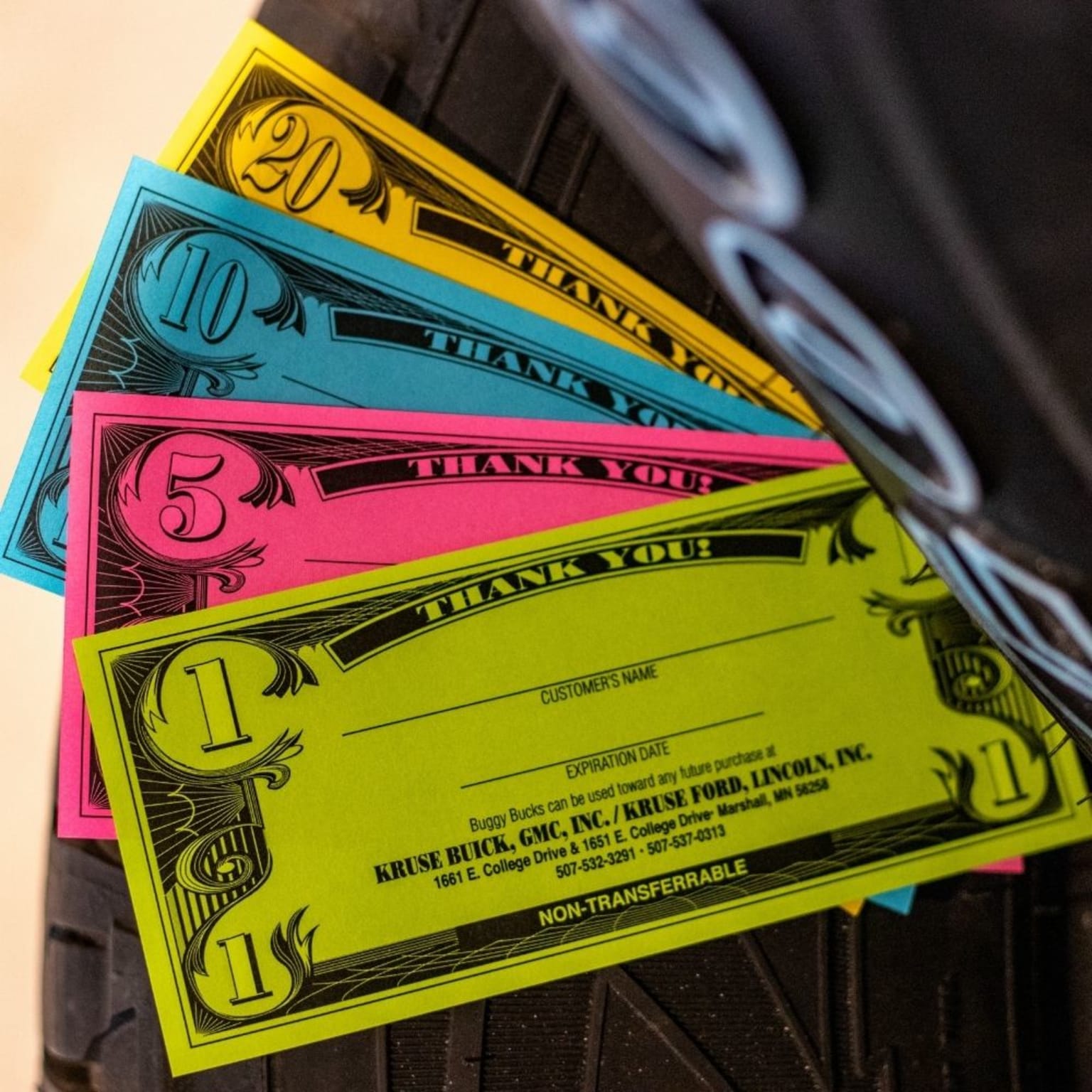 a pile of money sitting on top of a pile of plastic money notes on top of a pile of plastic money