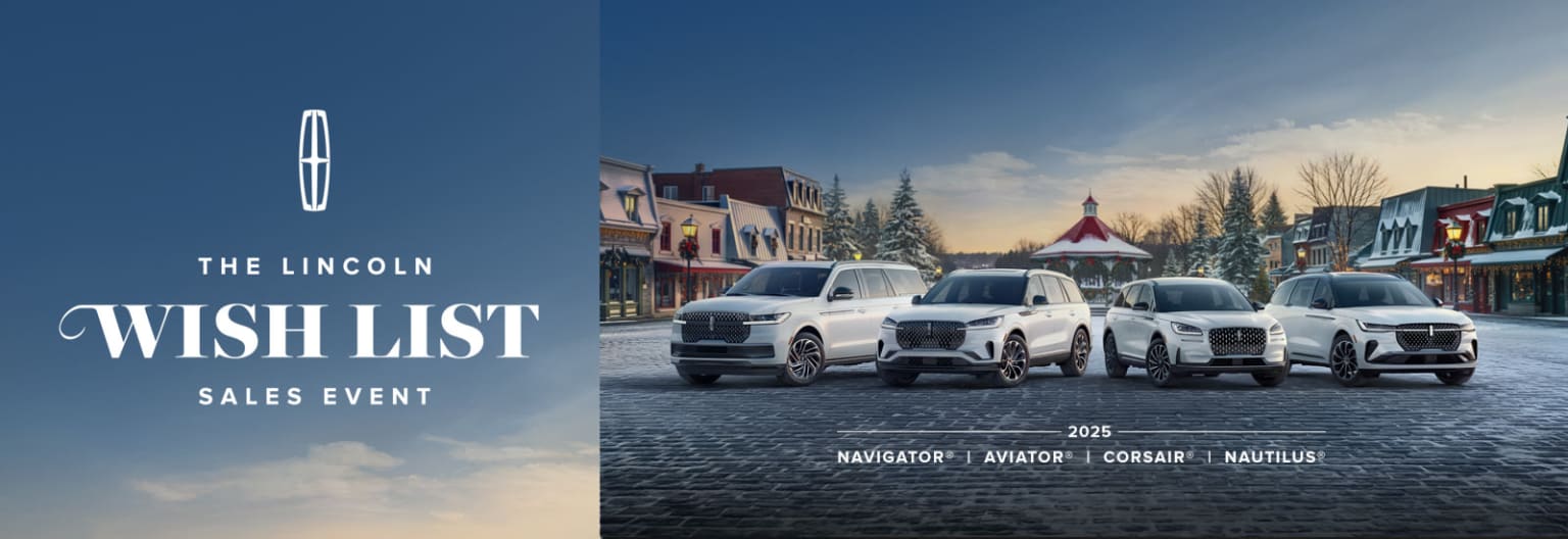 The image showcases a winter scene with several SUVs parked on a snowy street, surrounded by quaint buildings and a clear blue sky.