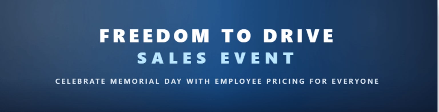 "Text on dark blue gradient background: FREEDOM TO DRIVE SALES EVENT. Smaller text below: CELEBRATE MEMORIAL DAY WITH EMPLOYEE PRICING FOR EVERYONE."