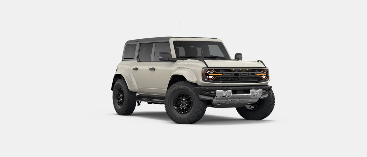 A light-colored SUV with black accents is positioned against a plain white background.