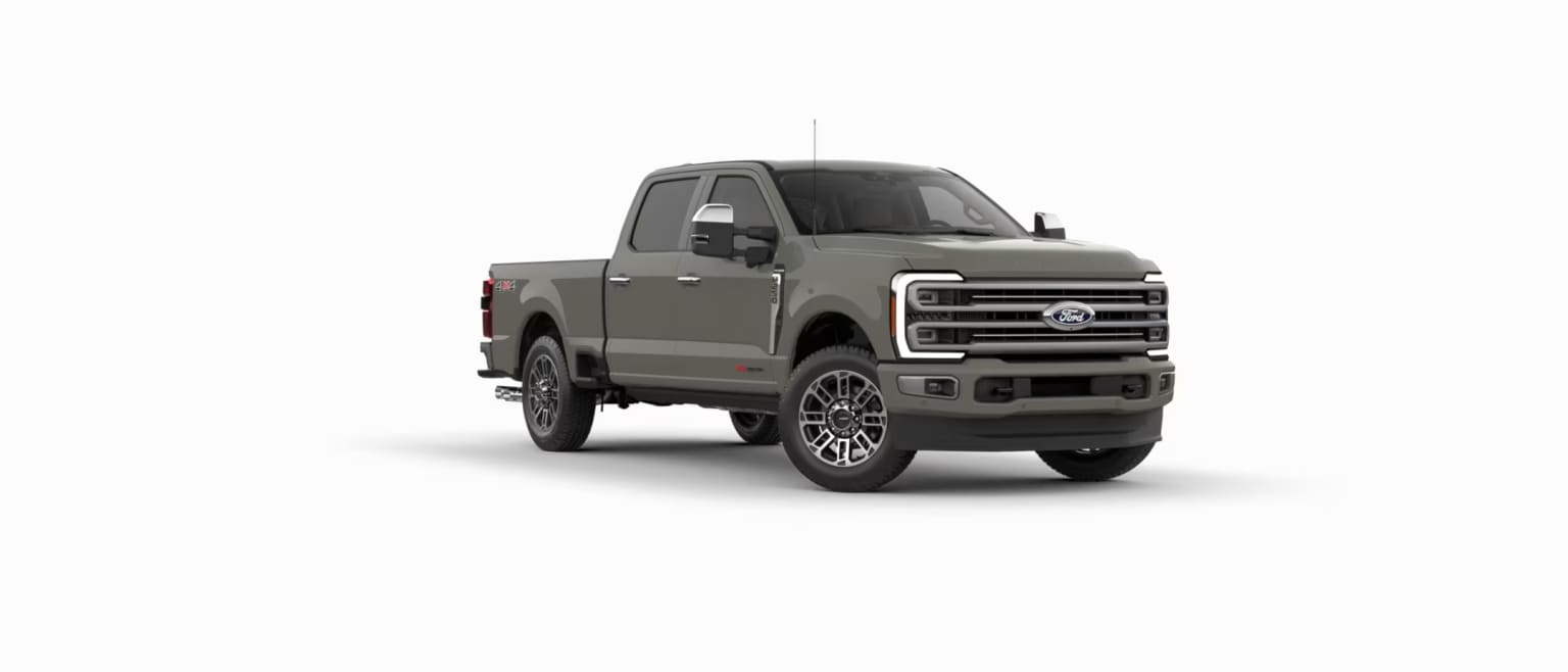 A grey pickup truck is parked in the center against a plain white background.
