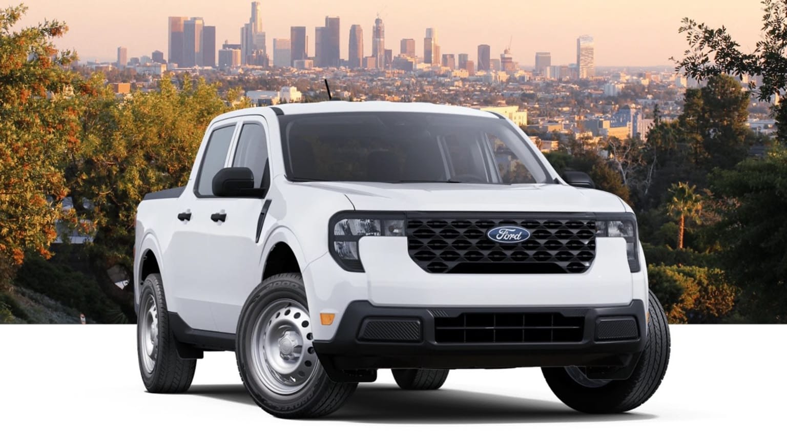A white pickup truck is prominently featured in the foreground, with a sprawling urban skyline visible in the background.