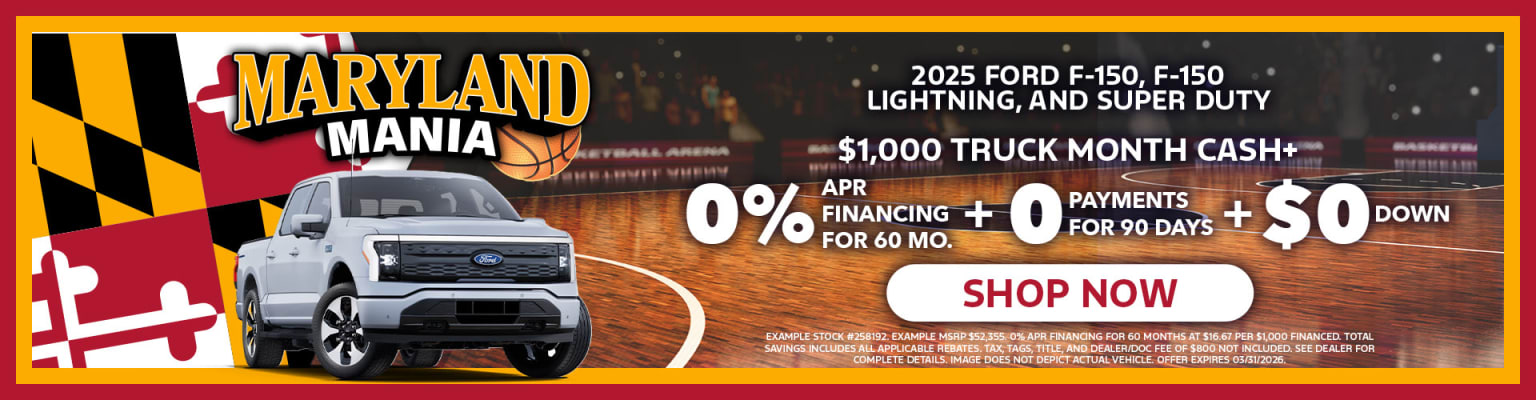 Image of a truck in the foreground with a basketball court and arena-style lighting in the background.