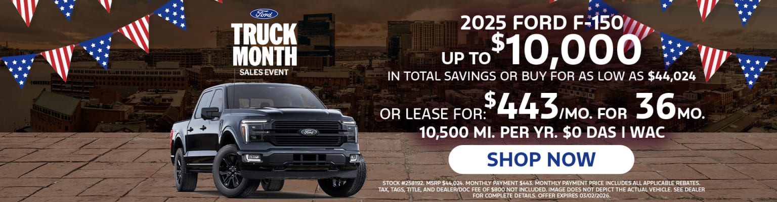The image shows a large black truck in the foreground with a promotional advertisement for a "Truck Month Sales Event" featuring details about the 2025 model and its associated savings or lease options.