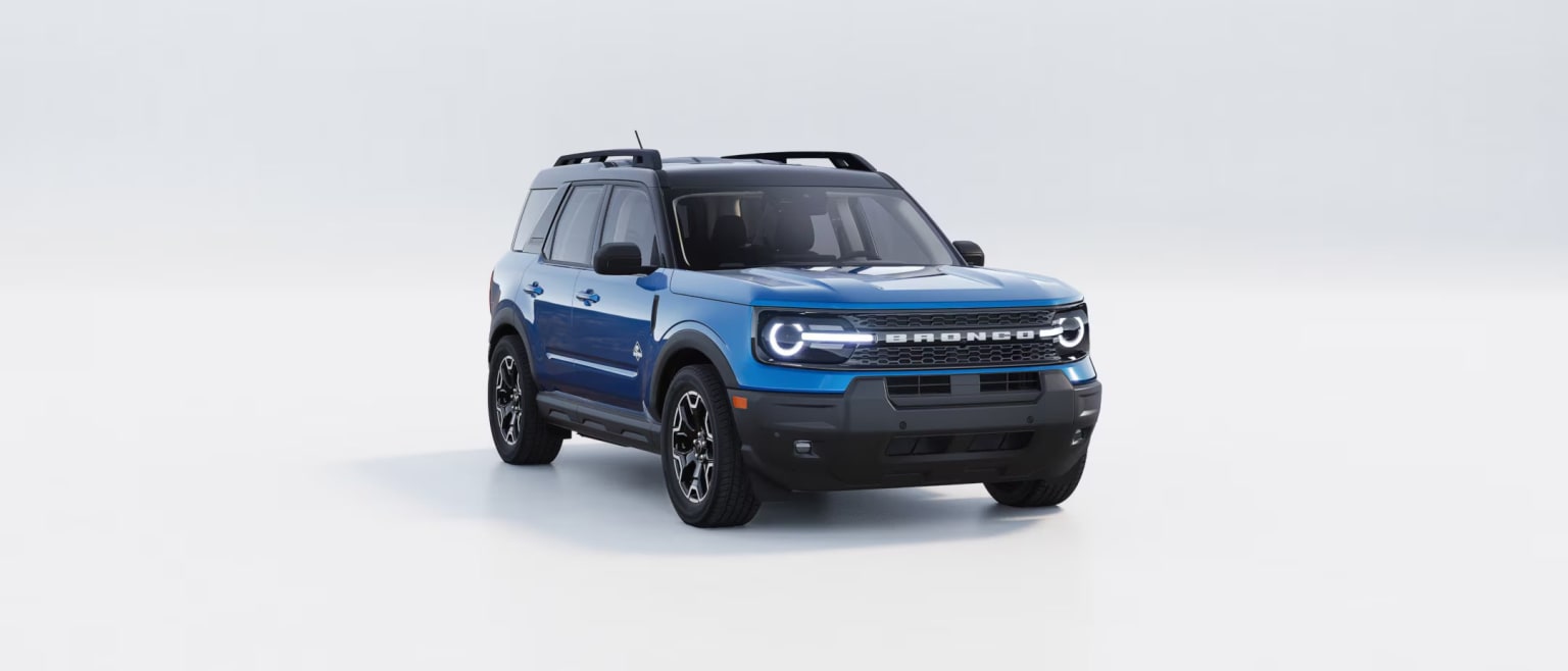 An off-road vehicle with a rugged design and large tires in blue and black color, against a plain white background.