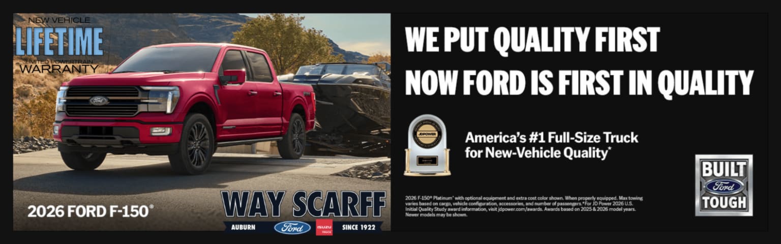 A red truck is parked on a gravel lot with a trailer behind it, set against a backdrop of mountains and trees, while text on the right advertises the vehicle's quality.