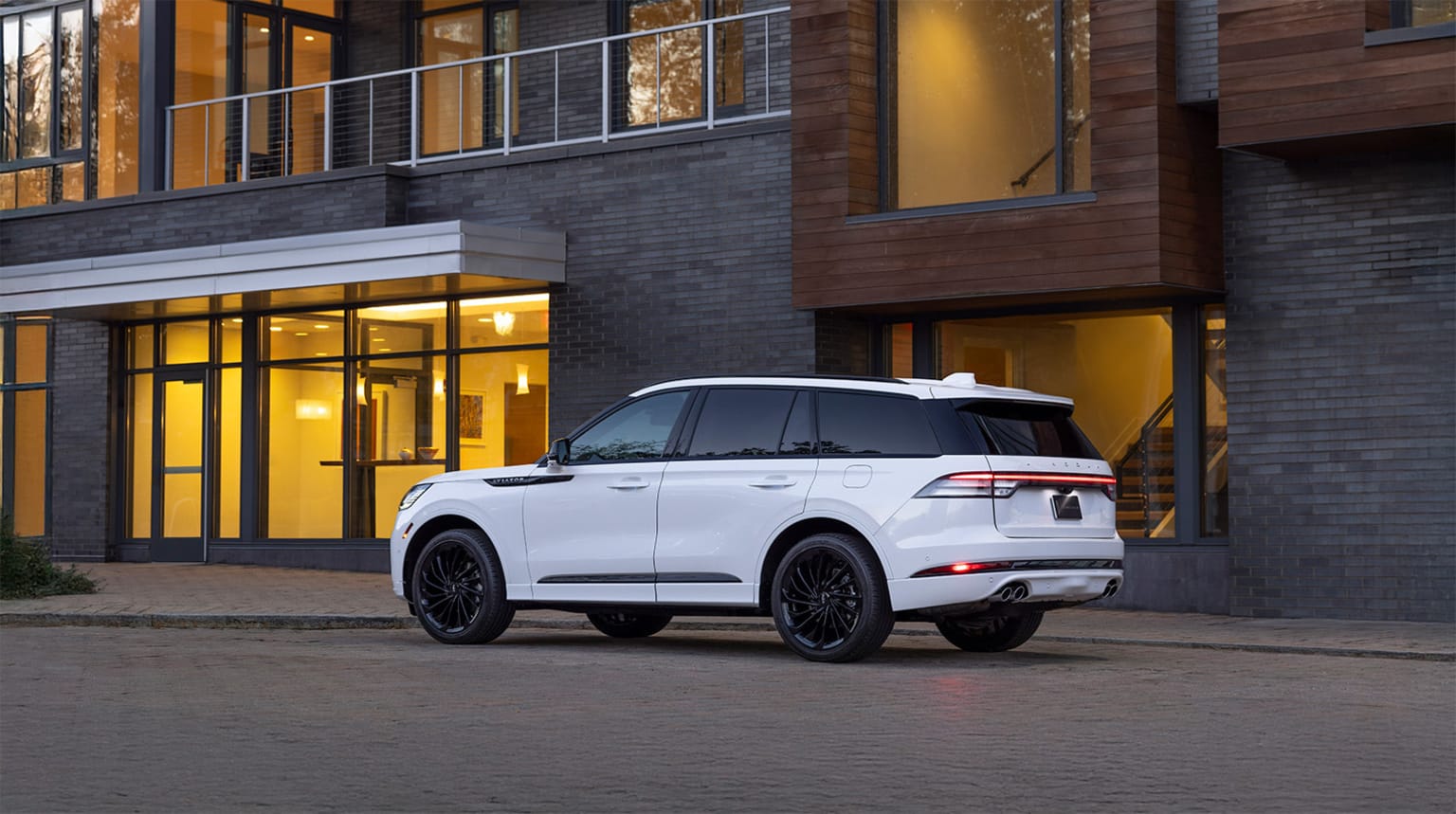 Lincoln Aviator Reserve with Jet Package paked outside of an apartment building in the evening