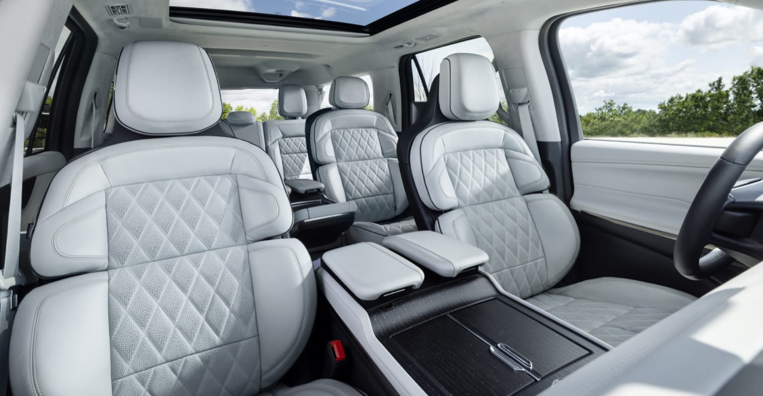 View of all 3-rows in the Lincoln Navigator interior with a white color scheme
