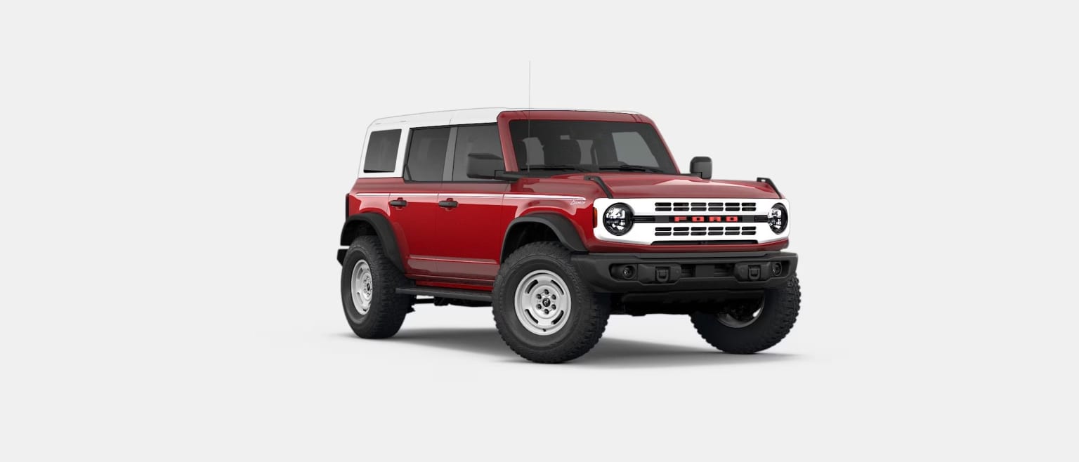 A red and white SUV is parked on a plain white background.