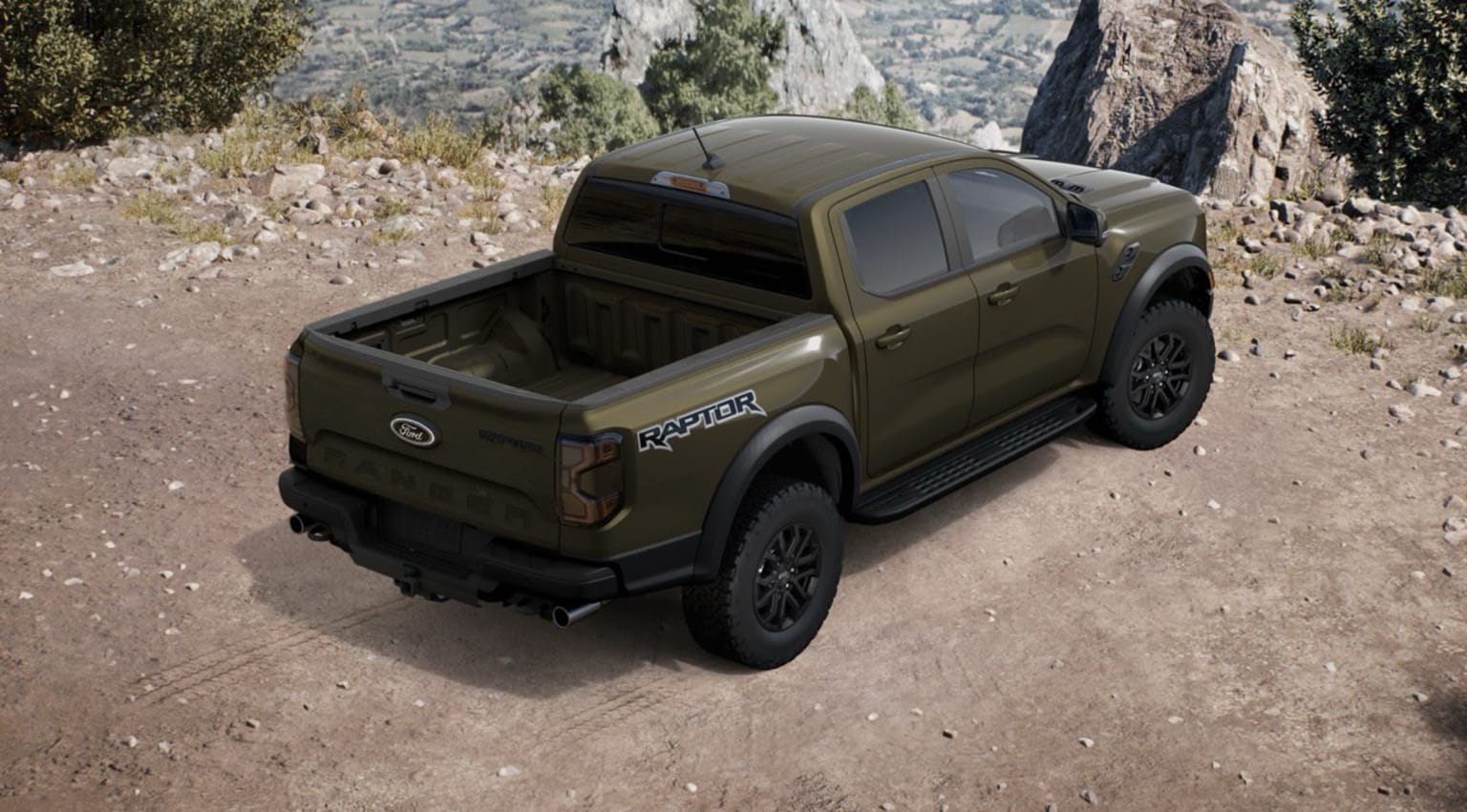 A rugged, off-road pickup truck in a muted olive green color is parked on a dirt path surrounded by rocky, mountainous terrain.