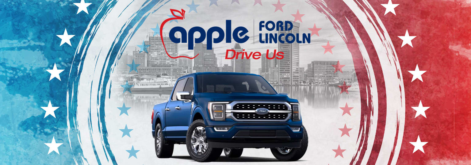 a blue truck parked in front of an american flag background with the words ford lincoln drive us in red, white, and blue