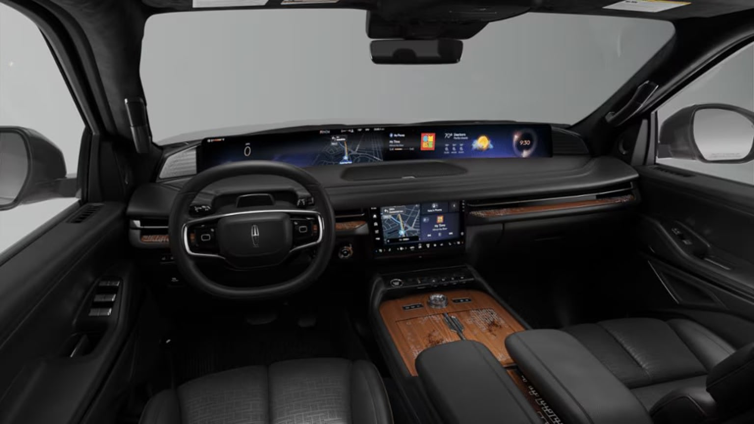 Interior of a modern, high-end vehicle with a sleek dashboard, steering wheel, and various digital displays and controls.
