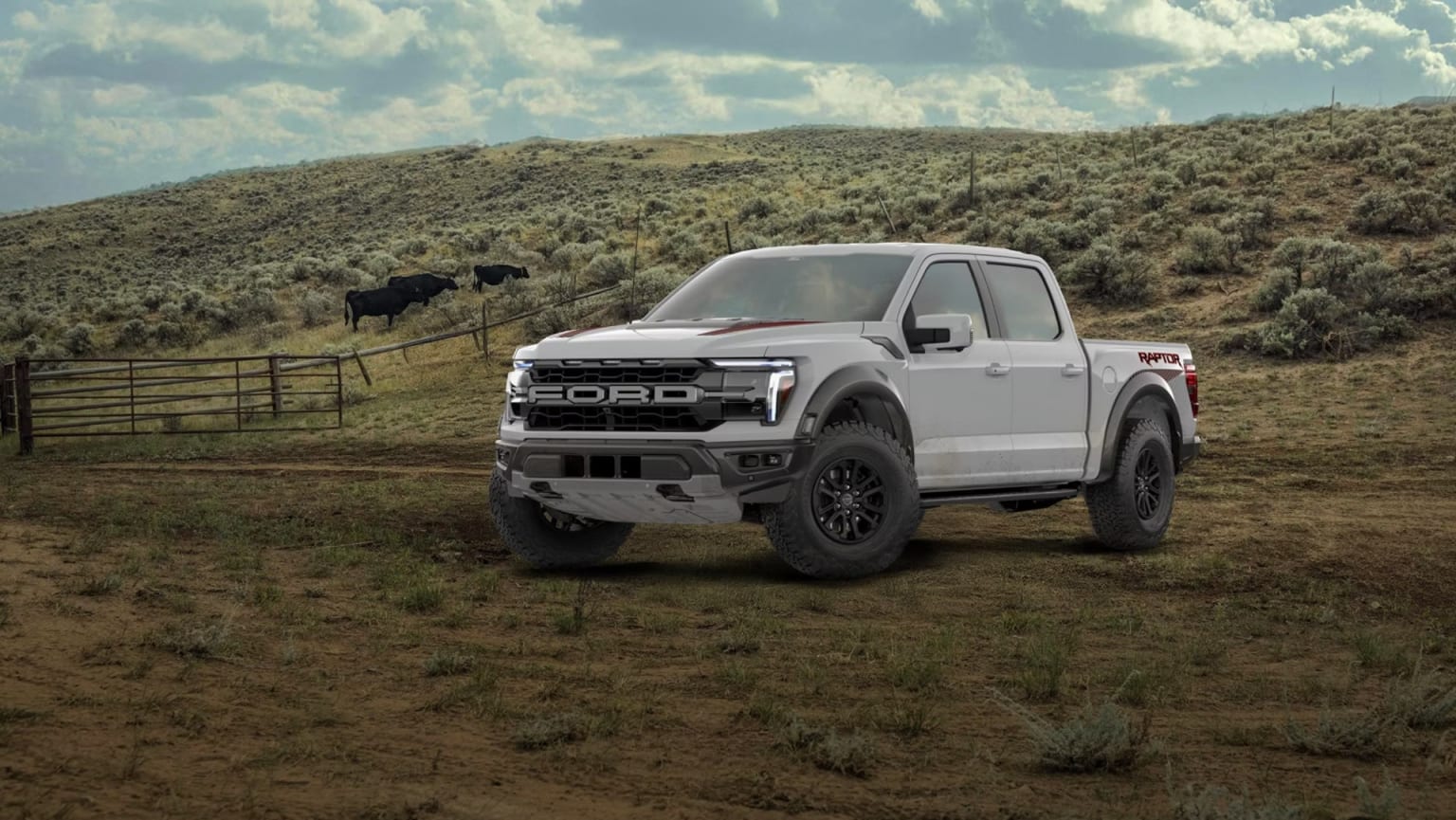 A rugged pickup truck stands in a grassy field, with rolling hills and cloudy skies in the background, and a herd of cattle visible in the distance.